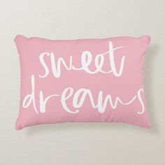 a pink pillow with the words sweet dreams on it