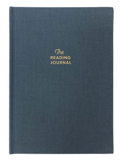 the reading journal is open and has gold lettering on blue paper, which reads'the reading journal journal '