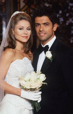 a bride and groom posing for a photo