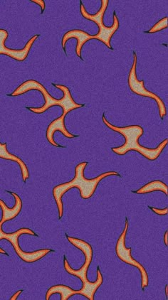 an orange and black fire pattern on a purple background