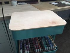 an office desk with lots of paint on it