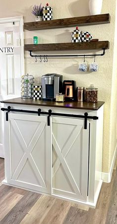 a coffee bar with two shelves above it