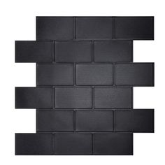 a black brick wall that has been made out of different pieces of black tile on it