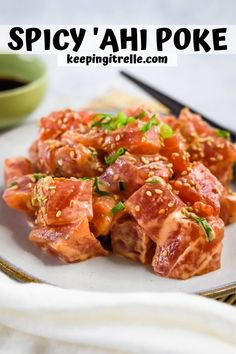 a plate full of food with the words spicy'ah poke on it