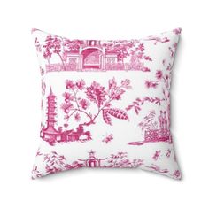 a pink and white pillow with chinese scenes on it