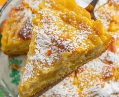 a close up of a piece of pie on a plate with powdered sugar over it