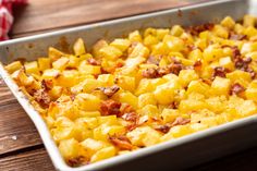 a casserole dish filled with potatoes and bacon