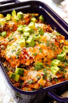 a casserole dish with meat, cheese and vegetables