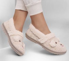 Cuddle up in adorable puppy style with BOBS from Skechers Too Cozy - Puppy Pal. This vegan slipper features a cozy sweater-knit upper with an embroidered 3-D Pup face design, faux-shearling trim and footbed, and a cushioned Skechers Memory Foam footbed. BOBS from Skechers is committed to saving the lives of pets in need. | Skechers Women's BOBS Too Cozy - Puppy Pal Slipper | Medium Width | Skechers Memory Foam cushioned comfort footbed | Crafted with 100% vegan materials | Sweater-knit upper wit Girls Gift Guide, Cold Weather Hats, Summer Clearance Sale, Skechers Memory Foam, Adorable Puppy, Lace Up Wedges, Wide Shoes, Waterproof Shoes, Skechers Women