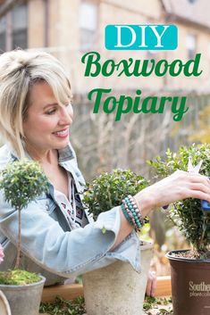 a woman is working in her garden with potted plants