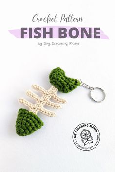 a crocheted fish bone keychain is shown in front of a white background