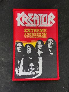 a red patch with the words kreator extreme aggression on it and three women