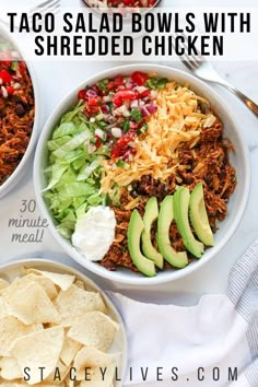 taco salad bowls with shredded chicken and tortilla chips on the side for lunch