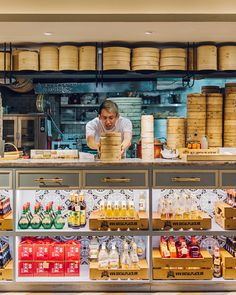 a man working behind the counter in a store