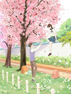 a man and woman standing next to each other near a tree with pink flowers on it