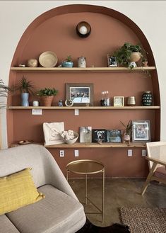 a living room filled with furniture and shelves covered in pictures on top of each shelf