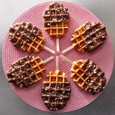 chocolate covered waffles arranged on a pink plate