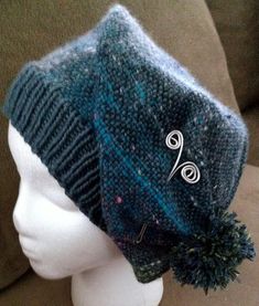 a knitted hat on top of a mannequin head