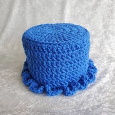 a blue crocheted hat on a white background