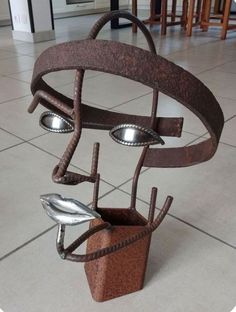 an artistic sculpture made out of metal parts