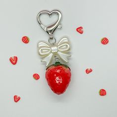 a red strawberry with a bow on it