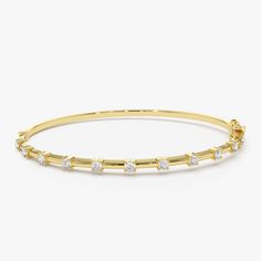 Discover timeless elegance with our 14K Gold Bar Bracelet, accentuated with 0.50ct of shimmering diamonds. A perfect blend of luxury and sophistication, this piece makes an exquisite bridesmaid gift or a stunning addition to your own collection. * Made to Order * Gold KT: 14K Solid Gold (also available in 18K  upon request) * Custom Gold Color: Rose Gold, Yellow Gold, White Gold * Round Diamonds: 11 pcs 2.3 MM * Total CTW: 0.55 Ctw * Diamond Color Clarity: G Color SI Clarity * Ready to Ship in 3-10 Business Days ▶ See more of our Diamond Bracelets - http://etsy.me/2mVrAB5 ▶ See our storefront here - http://etsy.me/2lUcVnH  ▶ All store sections here * Diamond Rings - http://etsy.me/2lwKUl8 * Diamond Earrings - http://etsy.me/2lyqVBP * Diamond Necklace - http://etsy.me/2mqa6O1 * Diamond Brac Classic Yellow Gold Bracelet With Channel Set, Classic Yellow Gold Bracelets Channel Set, Classic Yellow Gold Bracelet Channel Set, Yellow Gold Channel Set Bracelets For Wedding, Gold Bar Bracelet, Daily Wear Jewellery, Bar Bracelet, Gold Armband, Diamond Bangles Bracelet