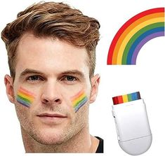 a man with rainbow painted on his face next to an electronic device and a rainbow