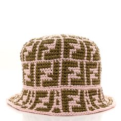 This is an authentic FENDI Straw FF Bucket Hat size S/M in Pink and Khaki. This stylish bucket hat is crafted of straw fabric in the style of the FF Fendi monogram. Woven Bucket Hat, Fendi Monogram, Hat Sizes, Bucket Hat, Straw, Fendi, Monogram, Hats, Fabric