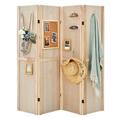 a room divider with pictures and hats on it