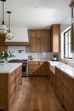 a kitchen filled with lots of wooden cabinets and white counter top space next to an oven