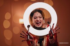 a woman holding up a mirror with her hands in front of her face