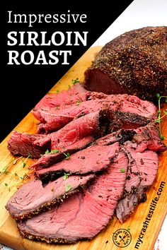 sliced roast beef sitting on a cutting board with herbs and seasoning next to it