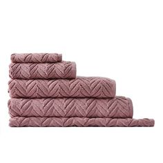 three pink towels stacked on top of each other