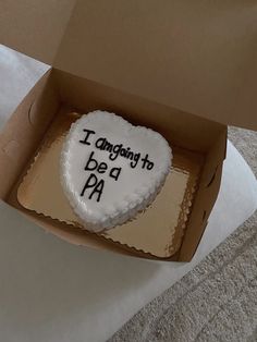 a cake in a box that says i am going to be a pa