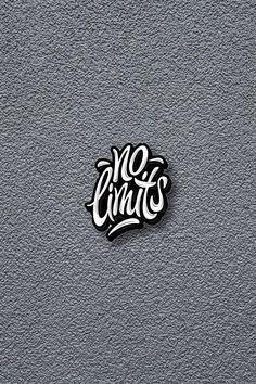 the vans sticker is on top of a gray wall and it says no limits