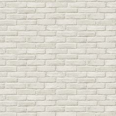 a white brick wall textured with cement