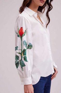 The FLOWERS shirt is the perfect way to show your appreciation for spring’s blooms. This lightweight tunic length shirt features a classic point collar and center button placket. The long sleeves are loose and gather at the French cuff that allow for cufflinks. The bottom hem is high low and features large scalloped edges. The sleeves also feature a single printed rose on each arm. This is a piece you will wear again and again! Tunic legth poplin shirt Classic point collar and center button placket The bottom hem is high-low and features large scalloped edges The long sleeves are loose and gather at the French cuff that allow for cufflinks The sleeves also feature a single printed rose on each arm 100% Cotton Follow care instructions on garment Anne Fontaine Spring - Summer 2023 Collection White Tunic Shirt, French Cuff Shirts, French Cuff, White Tunic, 2023 Collection, Flower Shirt, Tunic Shirt, Printed Sleeves, Tunic Length