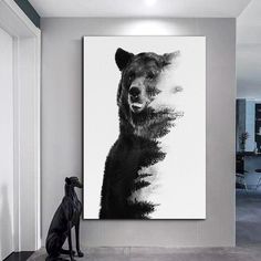 a black and white photo of a bear on a wall