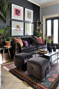 a living room filled with furniture and lots of plants