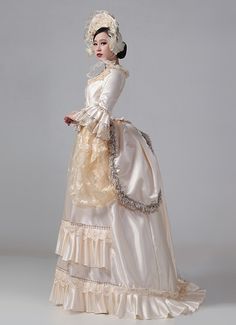 Champagne Victorian Bustle Reenactment Costumes Carnival Masquerade Party Dresses     Condition: Brand New   Color:Champagne   Material: This dress made of High Quality Satins,Lace, soft,smooth and comfortable to wear   Sleeve Length:Long Sleeve   Dresses Length:Floor-Length   Neckline:Square Collar   Decoration: Ruffles + Lace   Applicable People:Adult   Package Includes: Dress    amp;nbsp;     The length of skirt about 45 inches (114 cm) long from waist to hem regardless of size. This dress is Bustle Dress Victorian, 17th Century Gown, Roccoco Dresses, Rococo Dresses, 1700 Dresses, Victorian Bustle Dress, 19th Century Dresses, Masquerade Party Dresses, Bustle Dresses