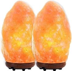 two orange himalayan salt lamps sitting on top of each other