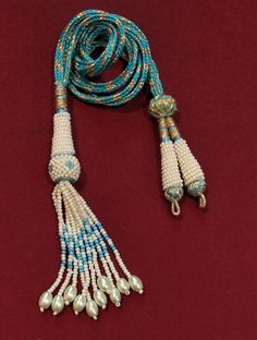 "Adjustable Handmade Necklace Thread, Indian Necklace Jewelry Necklace Cord with Beaded Tassels, Zari Dori Jewelry Supplies.. Bright and beautiful adjustable handmade necklace thread / SEA BLUE necklace cord with beaded tassels and brass lobster clasps. All the colors are Available Only on \"Special Requirement of Buyer\"  ON BULK Purchases Special Discount Shall Also be Provided Depending on Size and lot of Orders.. Also all Colorful Threads are Fully Handmade with Silk Thread..   Buyers Might Also See Slight Variations in Color Like Dark or Light.. Due to Picture Quality.. No Compromise on Our Product On Our Side. Looks good with big pendants or chokers can see in the picture. SIZE: 11 inches can go upto 18 inches ( 9 inches each side ) Only On *Special Demand*. You Will receive one Piec Traditional Beaded Necklace With Tassels, Traditional Handmade Adjustable Tassel Necklace, Turquoise Beaded Necklaces With Tassels For Gift, Turquoise Beaded Necklace With Tassels And Round Beads, Blue Beads For Jewelry Making And Festivals, Turquoise Beaded Necklace With Tassels, Blue Beaded Tassel Long Necklace, Blue Beaded Long Tassel Necklace, Blue Beaded Tassel Necklace