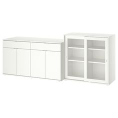 two white cabinets with doors and shelves next to each other