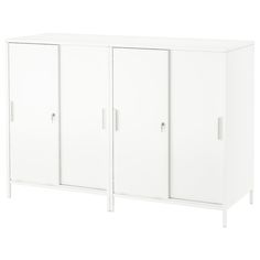 a white cabinet with three doors and two handles