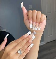 These long, square nails are a luxurious twist on the classic French tip. Adorned with rhinestones and pearl accents, each nail becomes a miniature work of art. The translucent nude base paired with the elongated tips adds sophistication, making this design perfect for a glamorous New Year’s Eve celebration. Ideal for those who love extravagant, head-turning nails. White Graduation Nails, Graduation Nails Ideas, Graduation Nail Art, Full Set Acrylic, Easy Nail Designs Summer, Nail Polish Colors Summer, Elegant Manicure, Summer Gel Nails, Graduation Nails