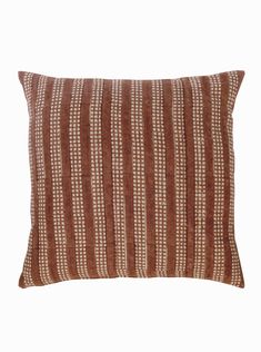 a brown and white striped pillow on a white background