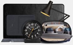 an assortment of office supplies including a clock