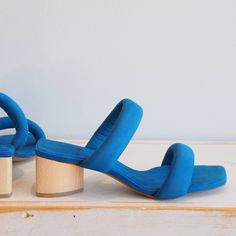 Bold And Minimal, Sofiya Is A Clean Two-Strap Sandal Slide. Each Strap Is Padded For Comfort And A Bit Of Drama, Which Complements The Delicate Silhouette. Heel Height 45mm (Approx. 1.7in). Made In Spain With A Lot Of Love And Integrity. This Style Runs Small. We Recommend Sizing Up. Blue Sandals With Wooden Heel For Spring, Blue Sandals With Low Stacked Heel, Blue Open Toe Heels With Wooden Heel, Blue Sandals With Wooden Block Heel, Blue Block Heels With Heel Loop, Blue Heels With Sculpted Heel For Spring, Blue Sandals With Wrapped Block Heel, Blue Block Heels With Wooden Heel, Summer Blue Heels With Sculpted Heel