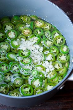 green peppers and onions cooking in a pot