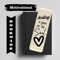 a bookmark with the words, smiling is good for the soul and heart on it